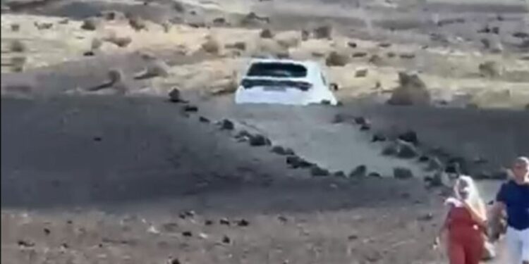 Car drives onto Volcán del Cuervo footpath