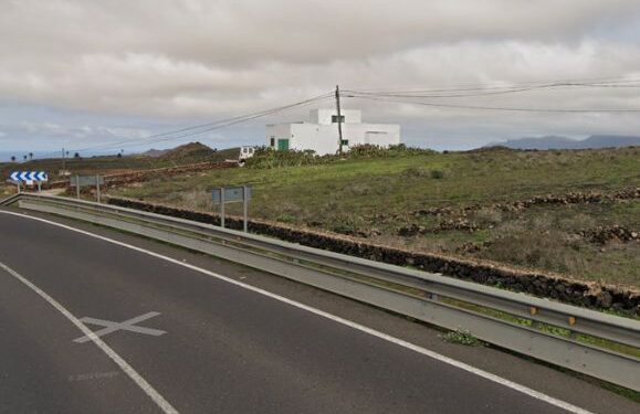 Vehicle stuck on crash barrier