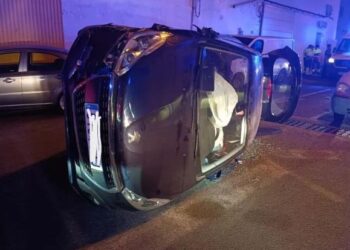Driver trapped after car overturns