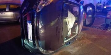 Driver trapped after car overturns