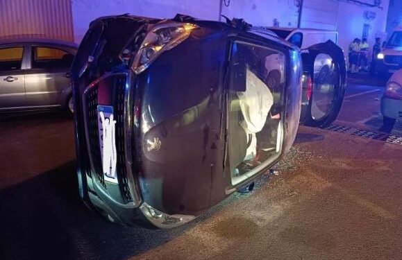 Driver trapped after car overturns