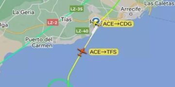 Plane diverts after minor falls unconscious