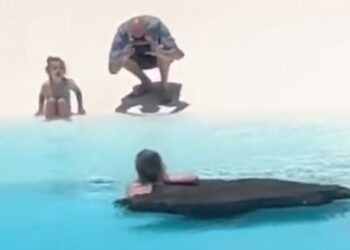 Tourist bathes at Jameos del Agua