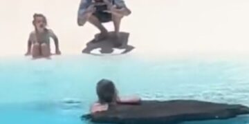 Tourist bathes at Jameos del Agua