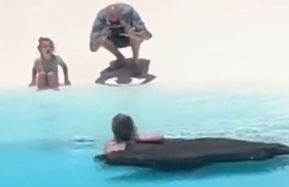 Tourist bathes at Jameos del Agua