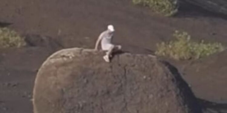 Tourists cause outrage after climbing volcanic bomb